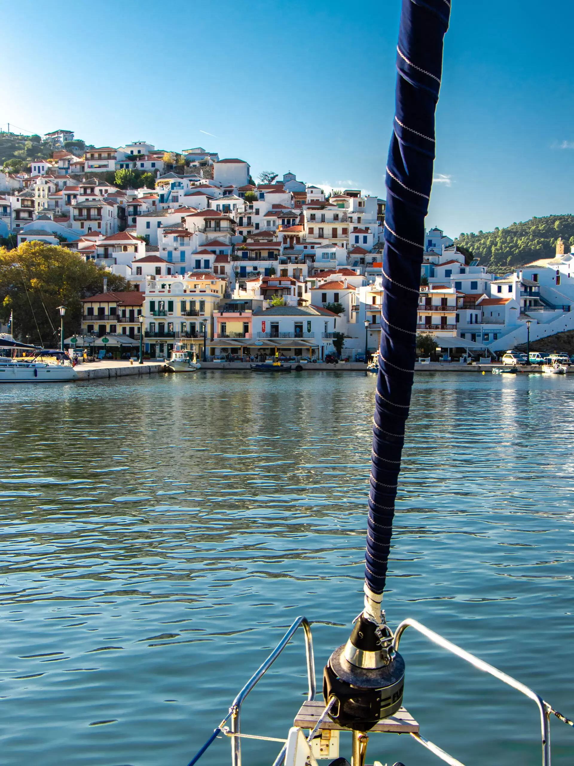 Skopelos Old Town and small greek houses on the hill as seen from the water on a sailing boat or yacht in the harbor sailingpassion segelferien